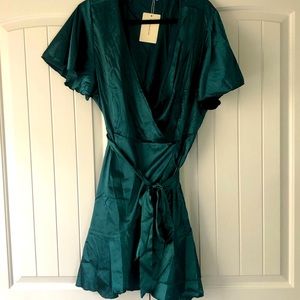 Silk-feel dress. Low cut. Rich emerald green.